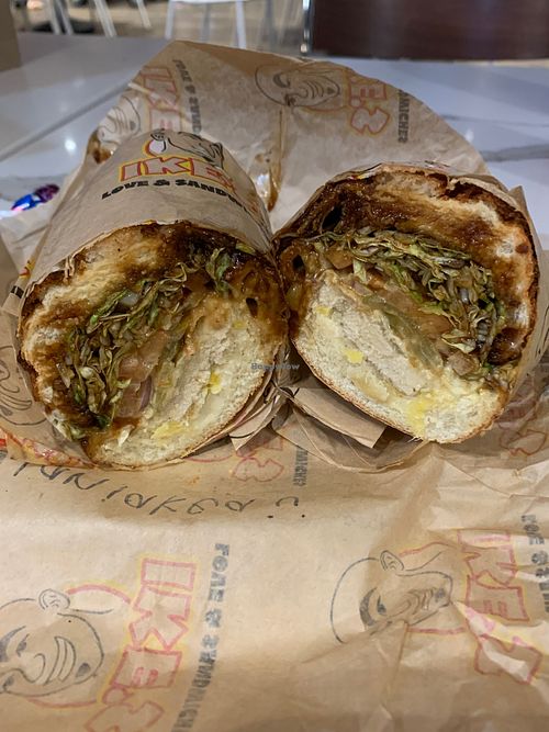 Exclusive Laniakea sandwich with vegan fried chicken, pineapple, teriyaki, vegan dirty sauce at Ike's in Honolulu