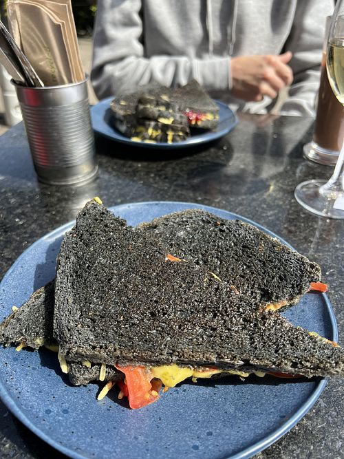 Tomato, pesto and cheeze on charcoal bread - yum  at Plantarium Cafe in Stratford-upon-avon