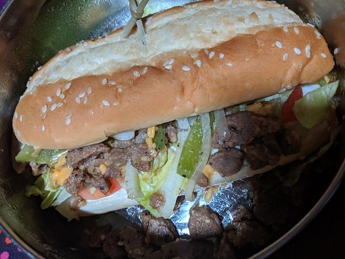 Philly cheese steak takeout, really good! at Wisdom's Vegan Bakery & Cafe in Spring