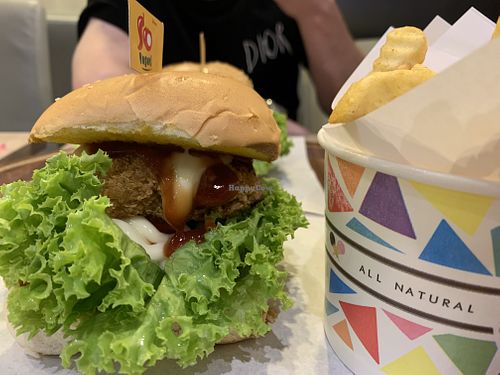 A lot of salad and sauce on the burger at So Vegan - Gateway Ekkamai in Bangkok