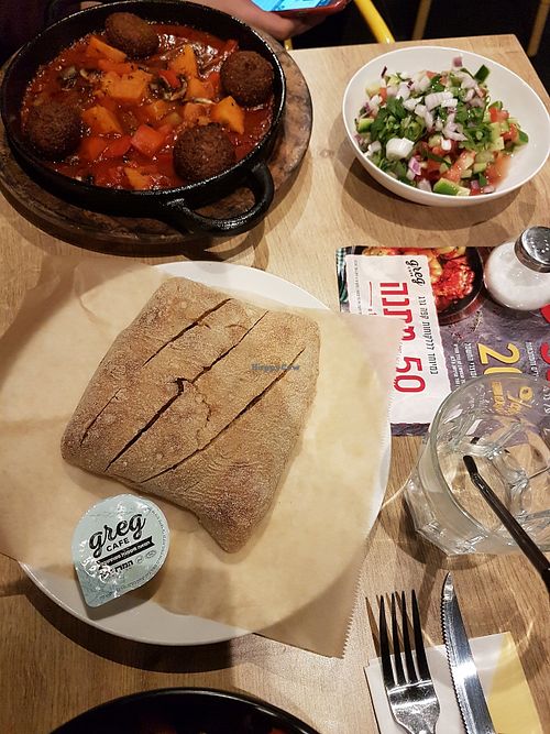 Vegan Shakshuka with falafel, bread and Israeli salad at Greg Cafe in Haifa