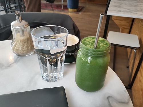 Green Mango smoothie and complementary water at L'Alchimiste in Brussels
