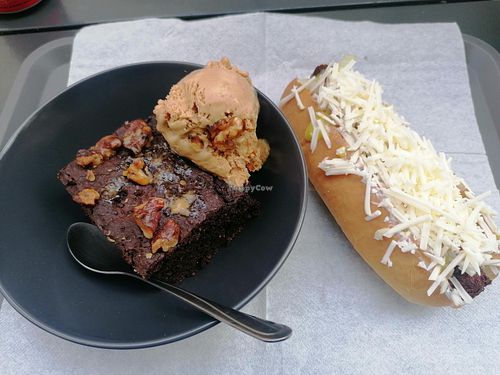 Spinach hot dog and chocolate brownie with icecream at Mel Vegan Fast Food in Tenerife