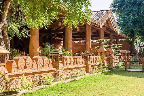 Fourteen genuine massive teak pillars support the roof.
 at 7 Sisters Restaurant in Bagan