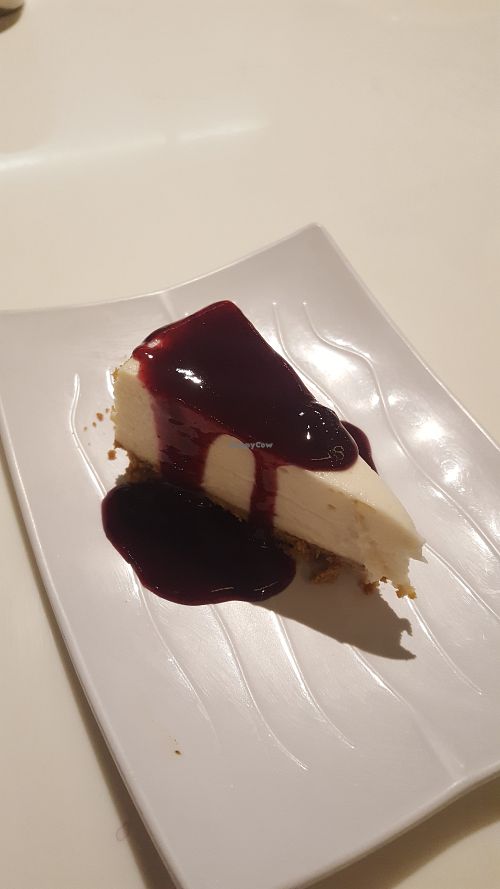 Cheesecake with blueberry sauce at Golden Era Vegan Restaurant in San Francisco