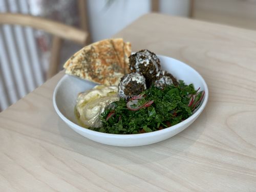 Hummus bowl with falafel, tabouli, pickles and pita at Colours Bowls in Prahran