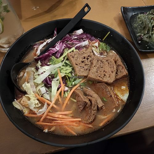 Sa-cha broth with rice noodles and marinated tofu at Baoz! Bar in Munich