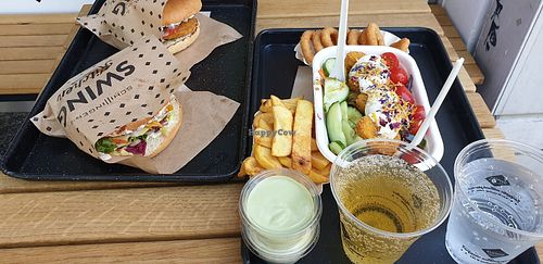 Schnitzel burger, cheese burger, nugget salad, chips, onion rings - yum!!  at Swing Kitchen - Schwedenplatz in Vienna