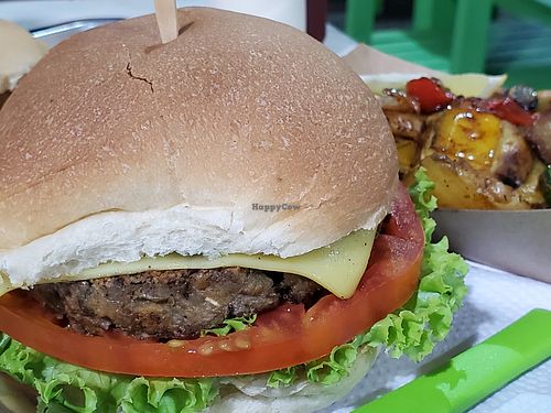 Lentil burger with grilled veggies side at Guacamole in Montevideo