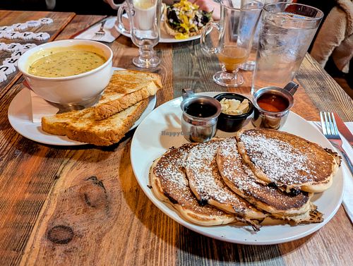 Bowl of Cheddar Veggie Soup and Blueberry Pancakes (Gyro in the background) at High Note Cafe in Boise