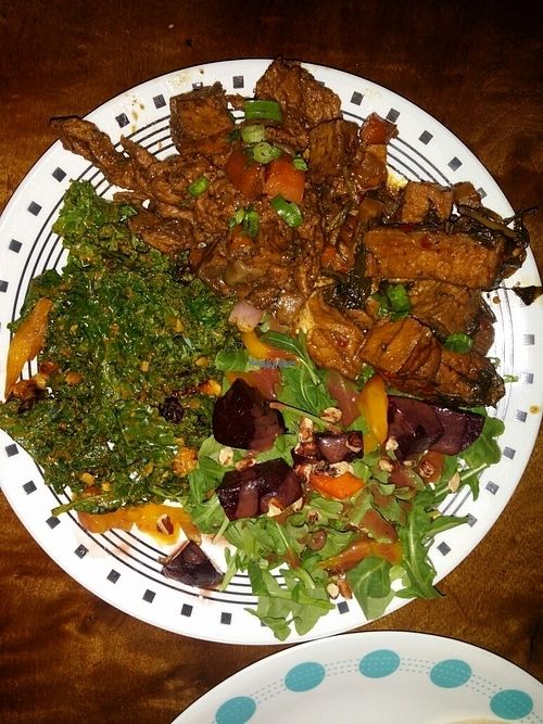 plate with jamaican jerk, kale salad, arugula beet salad and spicy basil tofu at Good Karma Artisan Ales & Cafe in San Jose