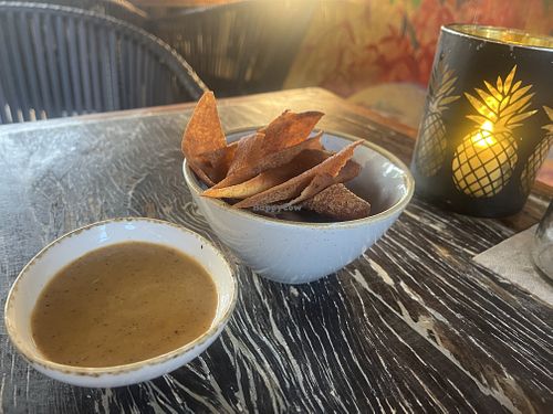 Freshly made tortilla chips with accompanying sweet dipping sauce  at Mosa in Willemstad