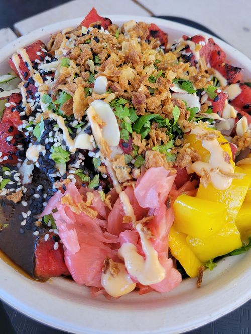 Ginger, mango, scallions and more I'm Watermelon Poke with sushi rice at Poke Food Station in Willemstad