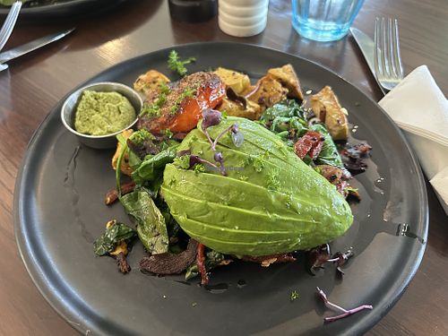 Tofu scramble - pesto and avocado with hash browned potato underneath!   at Ajuna Eatery in Napier