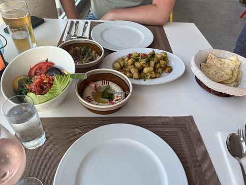 Lebanese spicy potatoes, houmous and pitta, baba ganouj and tabbouleh  at Byblos in Mellieha