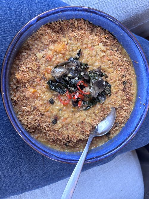 Swiss chard on red lentils cream topped with breadcrumbs  at Pele Surf Shack in Hook Of Holland