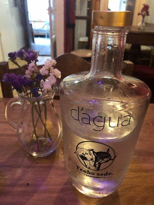 Small flowers on every table and filtered water at O Gambuzino in Lisbon