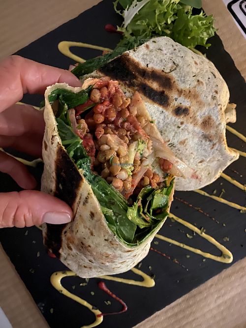 Wrap Optimista con lentejas y extra de queso vegano y cebolla al grill at Sanissimo - Gran Via in Madrid