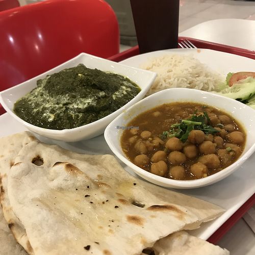 Lunch combo of palak paneer with basmati rice, salad, naan and garbanzos. Comes with a natural beverage. at Swaad in San Pedro