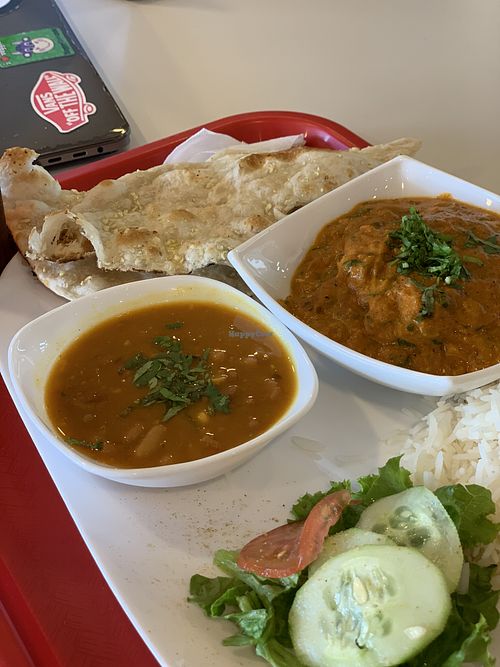 Tikka masala paneer with garlic naan, side of beans and basmati rice at Swaad in San Pedro