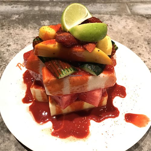 the Mexican Street Bowl - huge tower of fruit, jicama, mango, chamoy  at Puesto in La Jolla