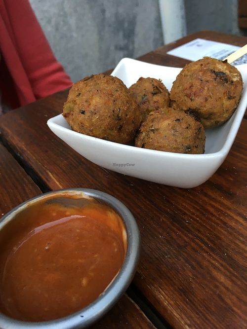 Chickpea cheese balls appetizer at Vegan Junkies in Lisbon