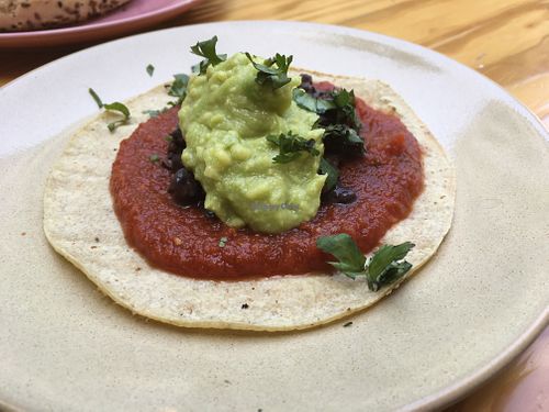 Avo-Rancheros (corn tortilla with black beans, shredded jackfruit, spicy tomato sauce, guacamole and coriander) at Vegan Junkies in Lisbon