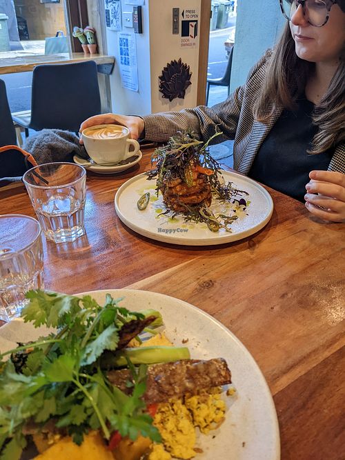 Corn fritters (background), Foreground (scramble tofu and polenta) at Little Lotus Cafe in Hobart
