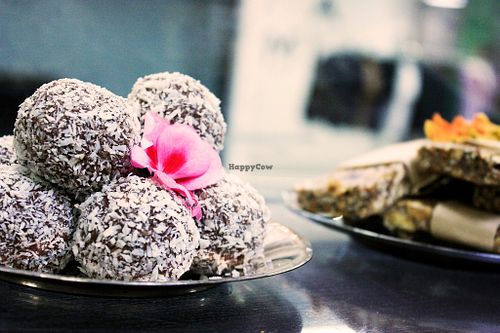 ”Chocolate balls” with kakaonibbs and in the corner a granola bar.  at Manna Kafé in Malmo