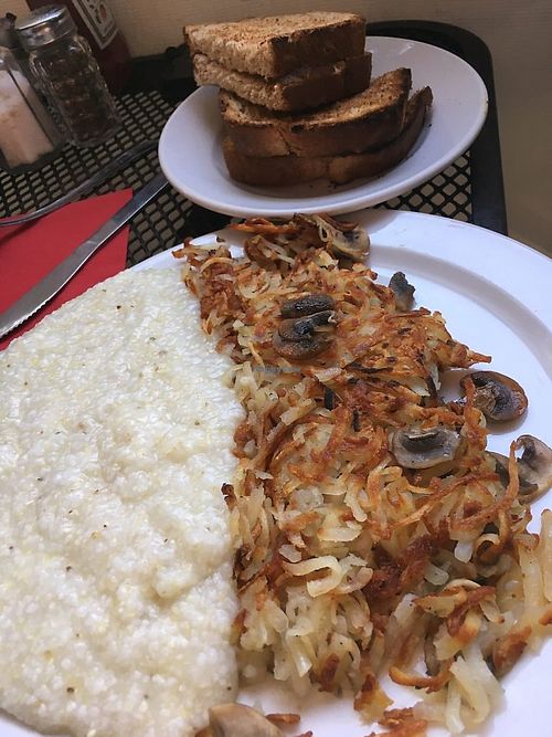 Hash browns with mushrooms extra crispy, a bowl of grits dry, and whole wheat toast dry. (This meal is assembled from ‘on the side’ options.) at SunRise Cafe in Hilton Head Island