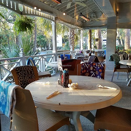 Outdoor seating on porch - dog friendly! at SunRise Cafe in Hilton Head Island