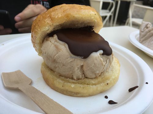 The donut with ice cream inside... chocolate on top of course. at Scoop 'n Dough in Lisbon