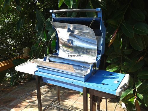 My own design of a Solar-powered oven for baking vegan breads, cooking dry grains, beans, baking sweet potatoes.  Has completely replaced our electric oven, from an old Weber BBQ at Loft on a Lake in Brownsville