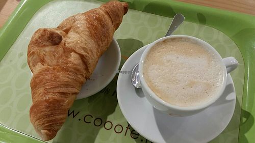 Croissant and coffee at Cooofe Bar in Barcelona