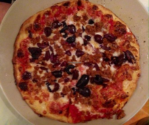 pizza with veggie sausage & kalamata olives at Brick Road Pizza Co in Grand Rapids