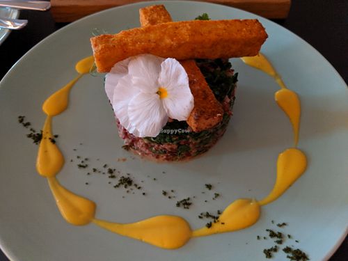 Red rice and kale mound with crispy tofu strips at Plant in Tallinn