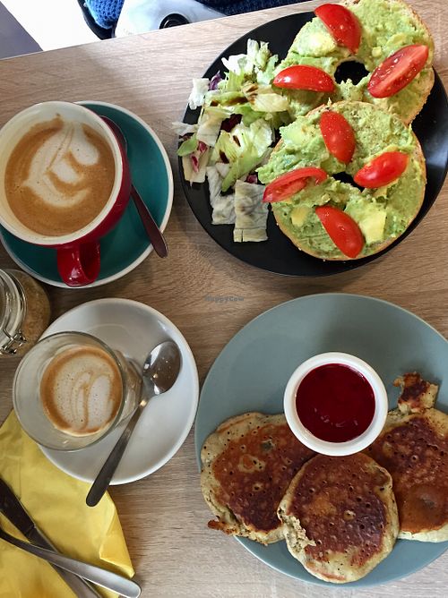 Vegan pancakes, avocado and tomato bagel, and cafe lattes with oat milk.  at Budapest Baristas in Budapest