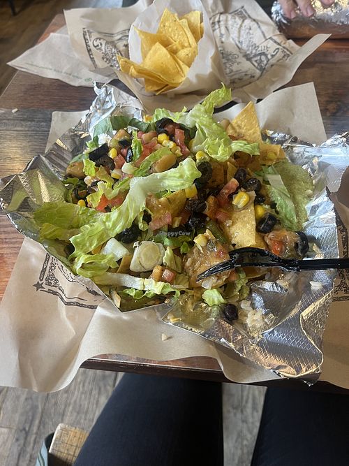 Nachos with vegan green chile and no queso  at Illegal Pete's  - Pearl St. Mall in Boulder