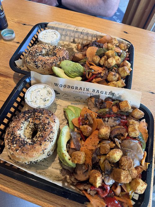 “Earth Skillet” with vegan chive cream cheese. You have to ask for the mods (it comes vegetarian but not vegan)  at WoodGrain Bagel in Boulder