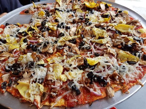 Burnout Pizza vegan pizza with veg cheese and beyond meat topping at Burnouts Pizza in Deadwood