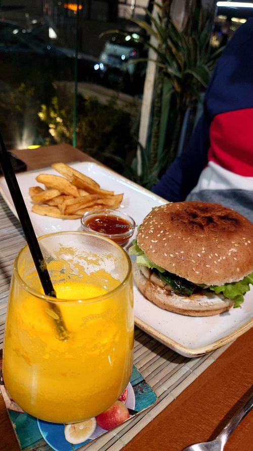 Vegan Burger and orange juice at Veggies in Tirana