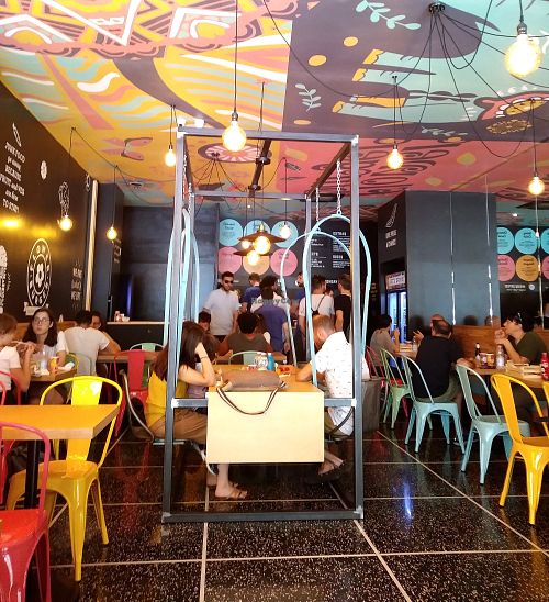 View toward counter to order and pick up food at Flower Burger in Bologna