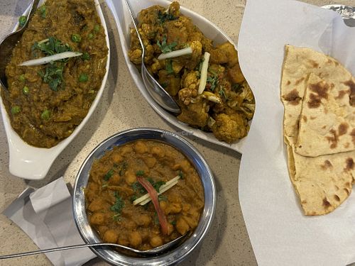 eggplant bhartha, chana masala, aloo gobi, roti  at Indian Masala Bistro in Whistler