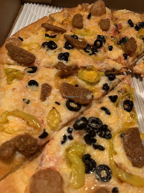 Vegan cheese, vegan sausage, b. peps, and blk olives. Dang at Pizzeria 1081 & Bakery in Akron