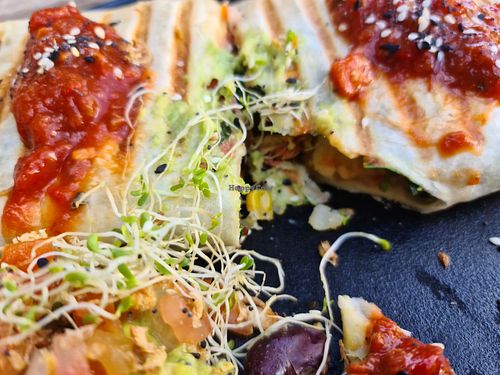 Vegan burrito, was so hungry after waiting 50 minutes, I had cut into it before I took the photo. Tasty, but without enough salsa or sour cream.  at Argi in Kensington