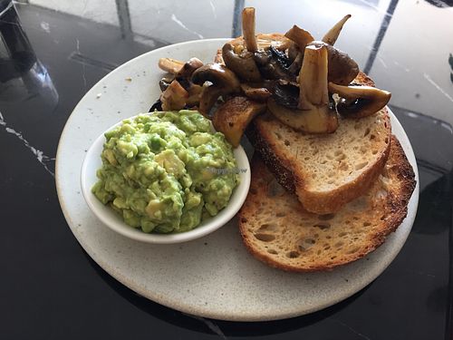 Toast with smashed avocado and mushrooms  at Wollemi in Canberra