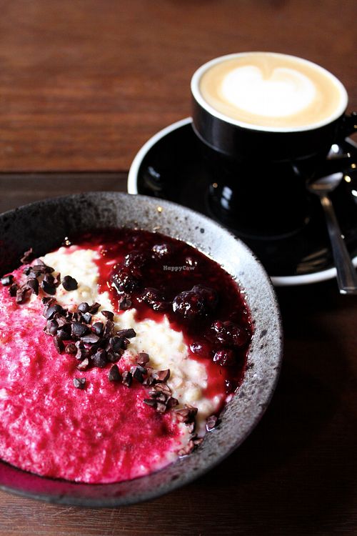 berry porridge with a cappuccino at Tamper Sellers Wheel in Sheffield