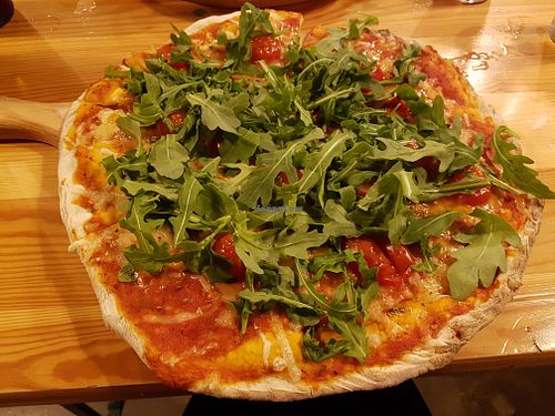 Mediterranean pizza with vegan cheese at DogTown Lagos in Lagos