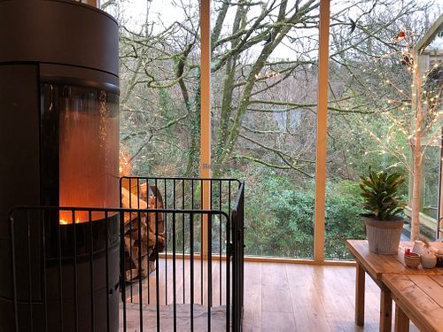 Most of the seating is chairs around tables but there’s a (leather 😞) sofa and chair by the fire. at St Nectan's Glen in Tintagel