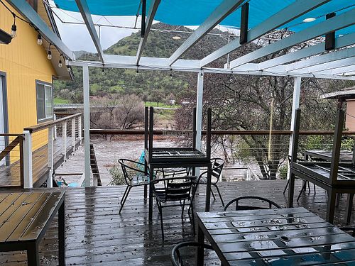 Outdoor terrache overlooking Kaweah River at Sierra Subs & Salad in Three Rivers